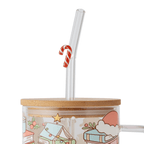 Candy cane glass straw in a Christmas glass cup with bamboo lid