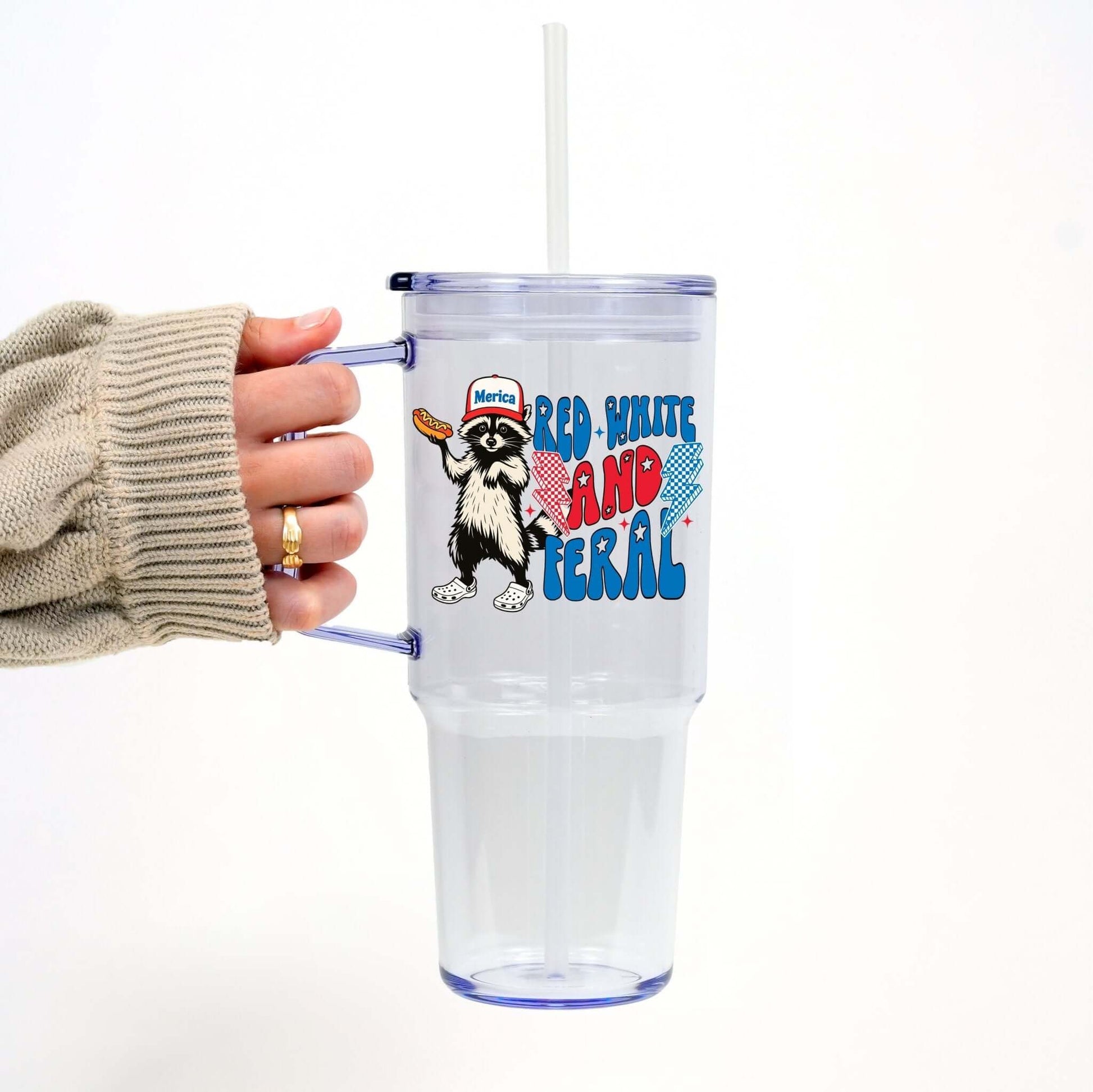Red White and Feral Hot Dog Patriotic Raccoon Tumbler With Lid and Straw from Sip Sip Hooray – Tumblers