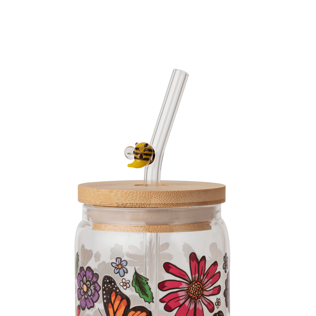 Bee glass straw in a floral glass cup with bamboo lid