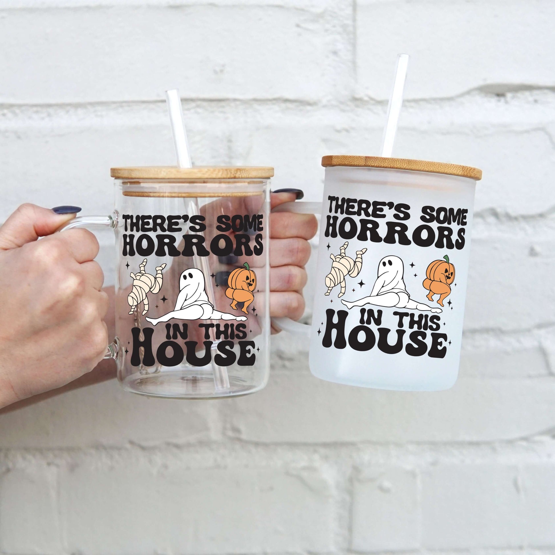 There's Some Horrors In This House 17oz Glass Mug With Lid and Straw from Sip Sip Hooray – Drinkware