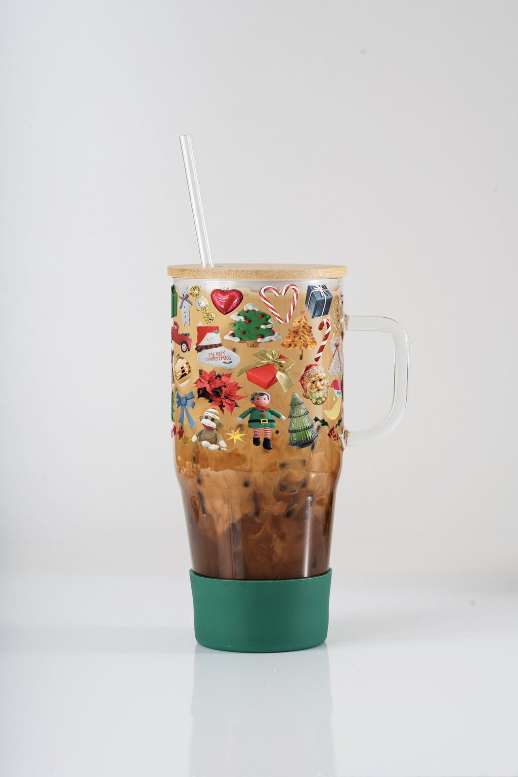 Christmas Trinkets 40oz glass tumbler with forest green silicone boot, bamboo lid and straw