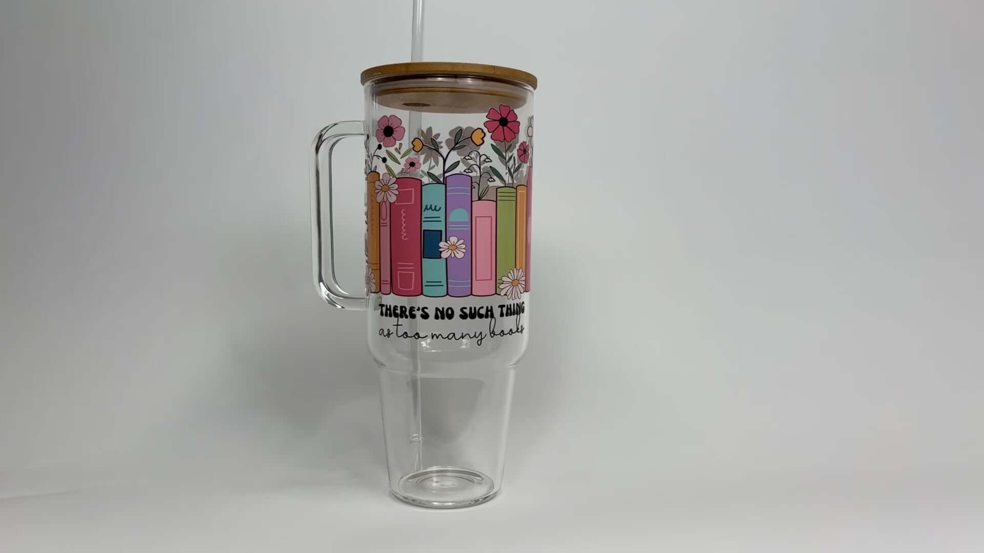 Load video: No Such Thing as Too Many Books 40oz Glass Tumbler With Lid and Straw from Sip Sip Hooray – Drinkware