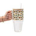 Vintage Halloween Stamps original UVDTF-printed design on a handmade glass tumbler with bamboo lid and straw by Sip-Sip Hooray!